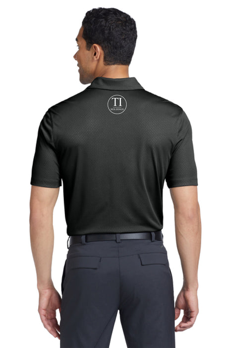 Man wearing a black polo shirt with a TI Holdings logo on a white background