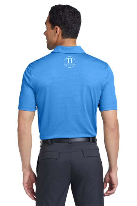 Man wearing a blue polo shirt with a TI Holdings logo on a white background