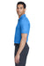 Man wearing a blue Nike Chrome Enhancements polo shirt and gray pants on a white background