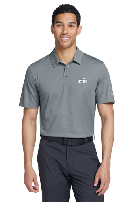 Man wearing a gray Chrome Enhancements polo shirt and pants on a white background
