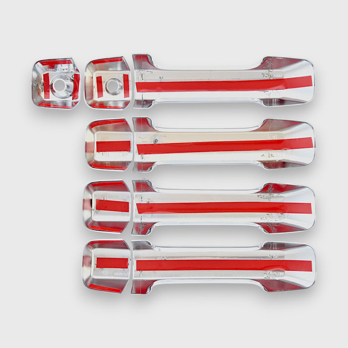 Set of chrome car door handles on a white background