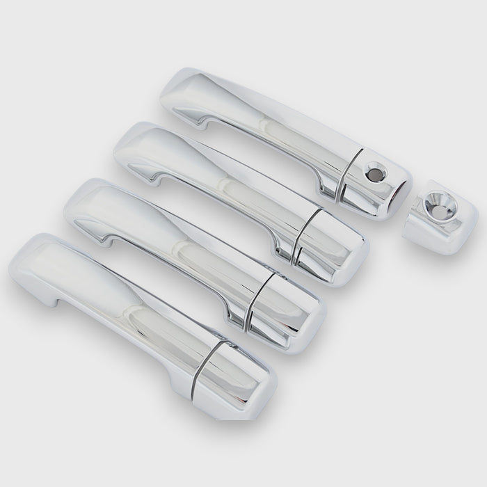 Set of chrome car door handles on a white background