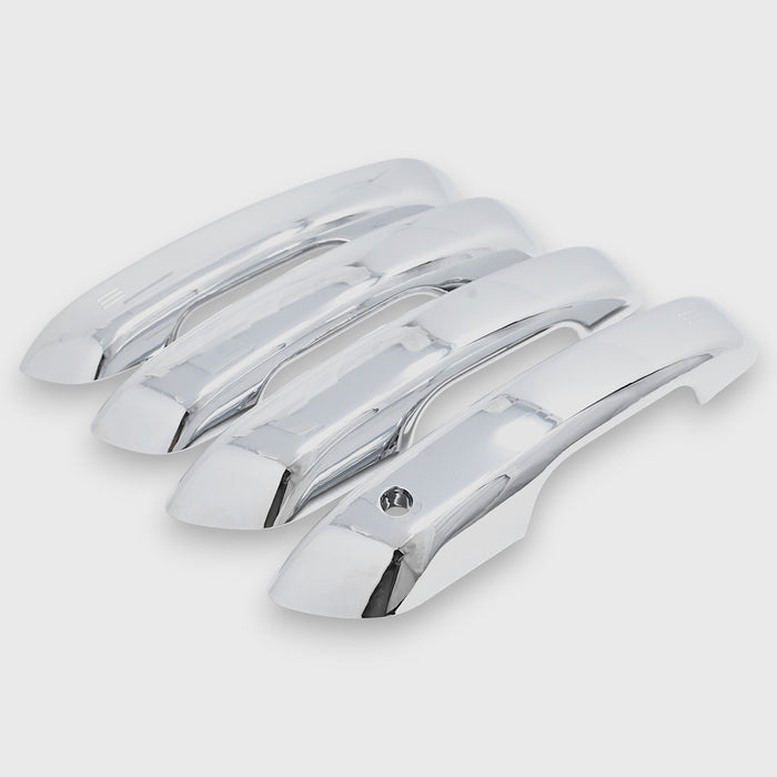 Set of chrome car door handles on a light gray background
