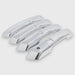 Set of chrome car door handles on a light gray background