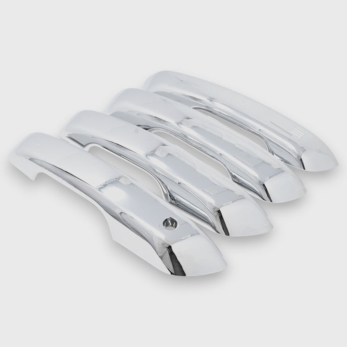 Set of chrome car door handles on a light gray background