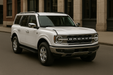 White Ford Bronco SUV with chrome trim installed