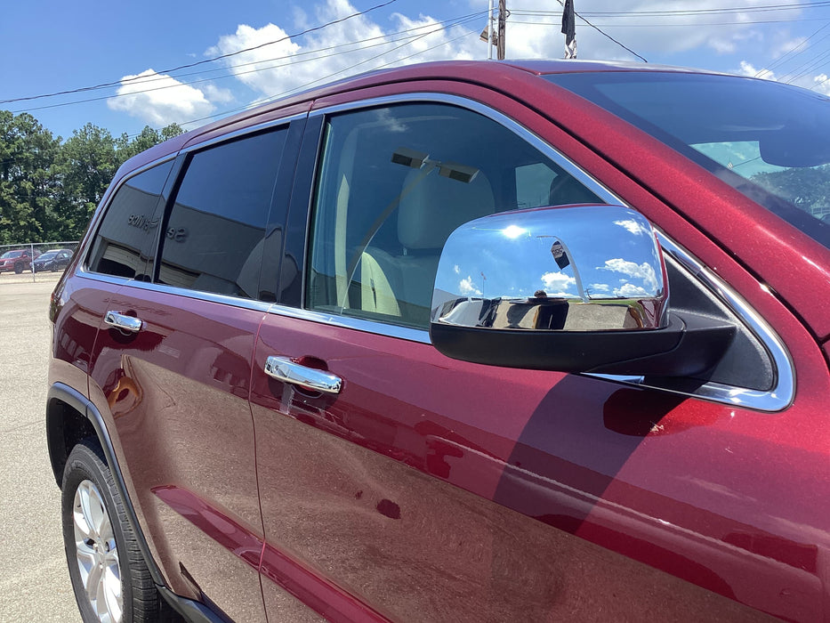Red Grand Cherokee with chrome trim accessories installed