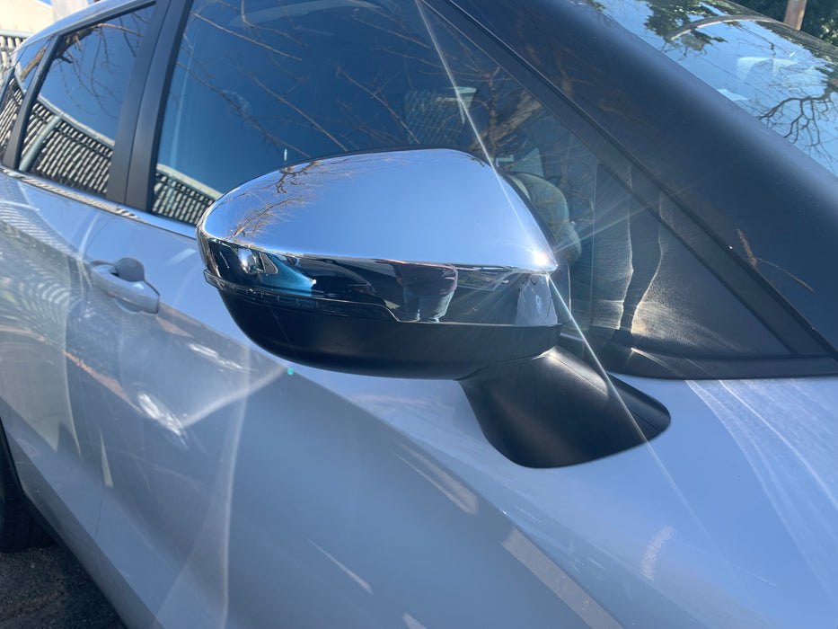 Close view of chrome mirror cover installed on Outlander