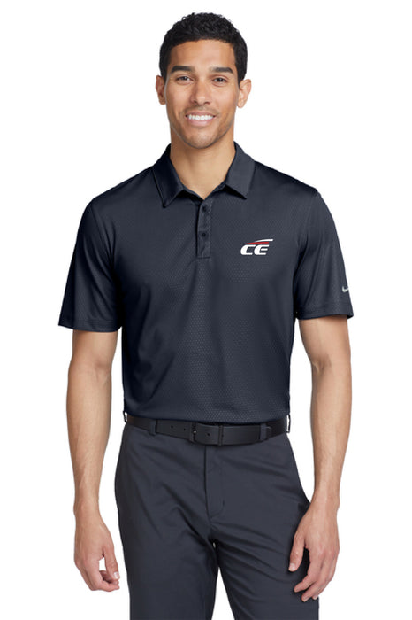 Man wearing a dark blue Chrome Enhancements polo shirt on a white background