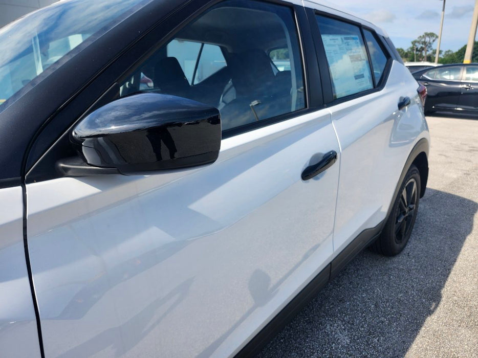 Nissan with chrome delete mirror covers and door handles installed