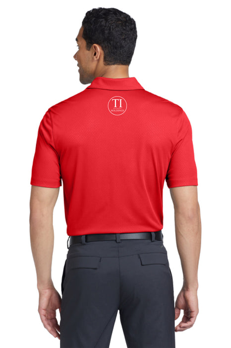 Man wearing a red polo shirt with a TI Holdings logo on a white background