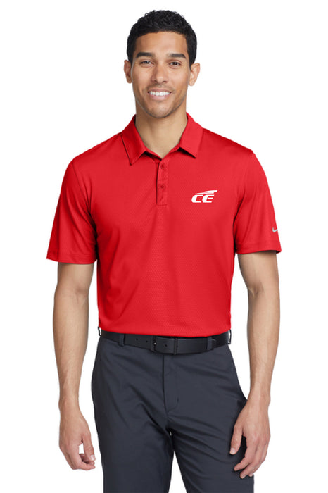 Man wearing a red Nike Chrome enhancements polo shirt and dark pants on a white background