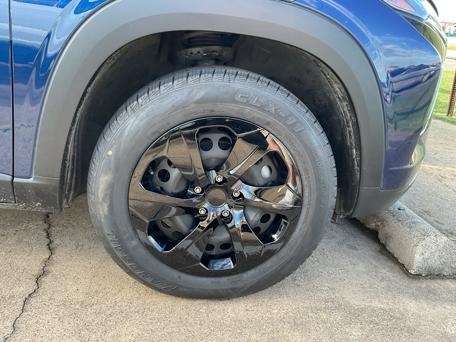 hubcap installed on blue vehicle