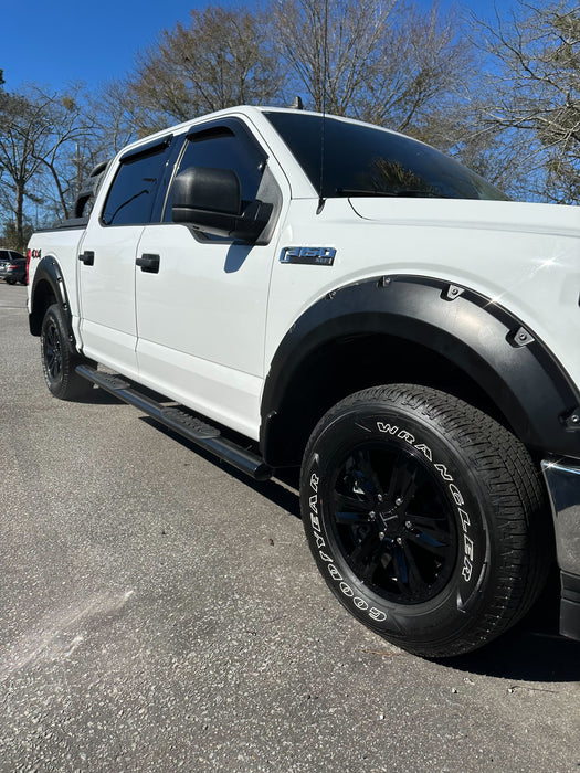 White pickup truck with black wheel skins installed