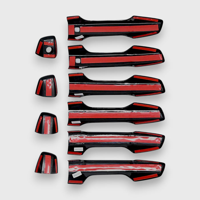 Set of black car door handles on a white background