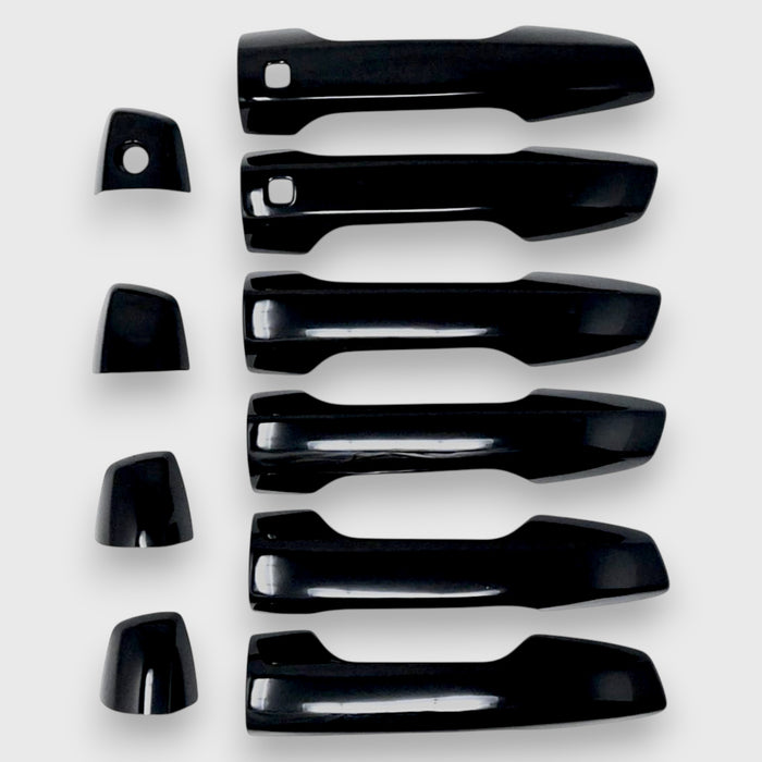 Set of black car door handles on a white background