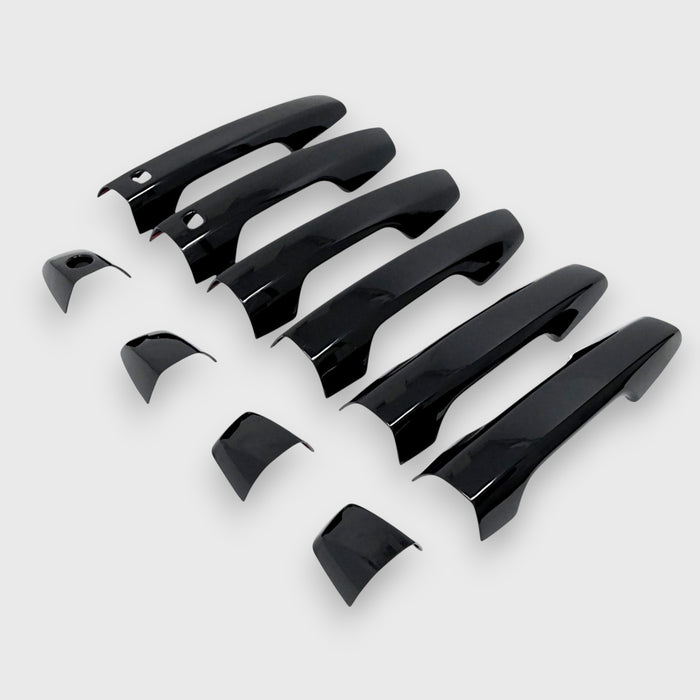 Set of black car door handles on a white background