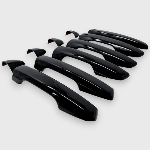 Set of black car door handles on a white background
