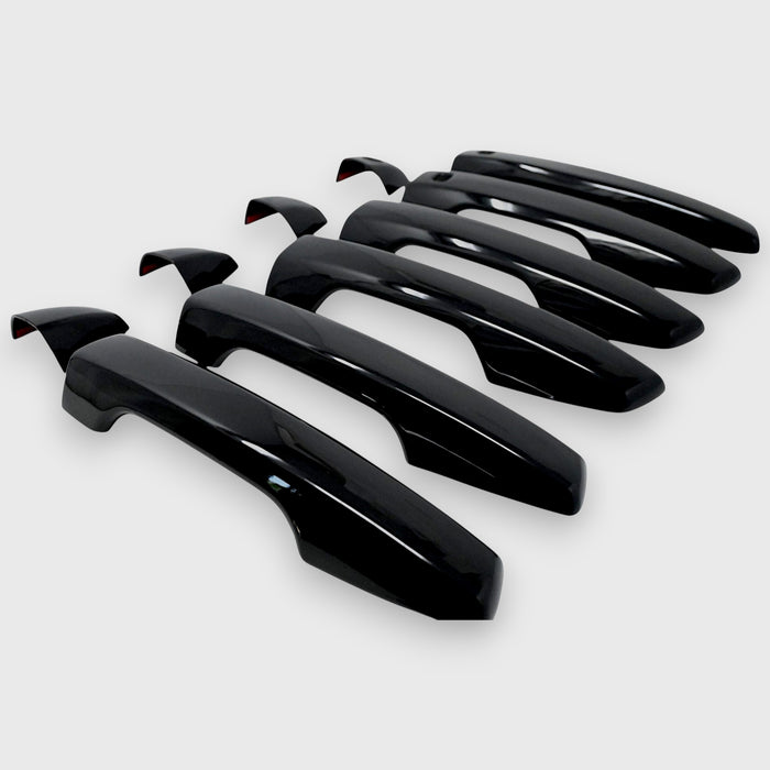 Set of black car door handles on a white background