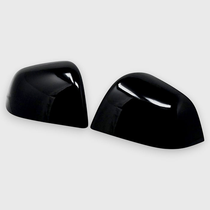 Two black chrome delete car side mirrors with red accents on a white background