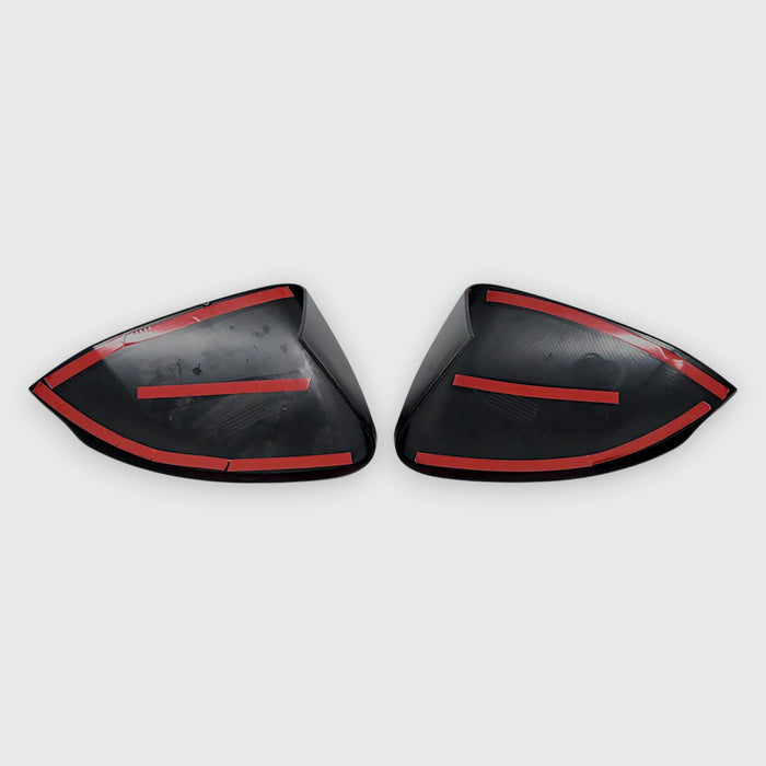 Two black car mirrors on a white background