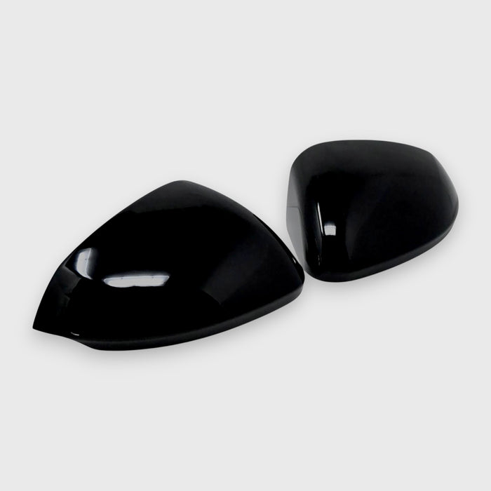 Two black car mirrors on a white background