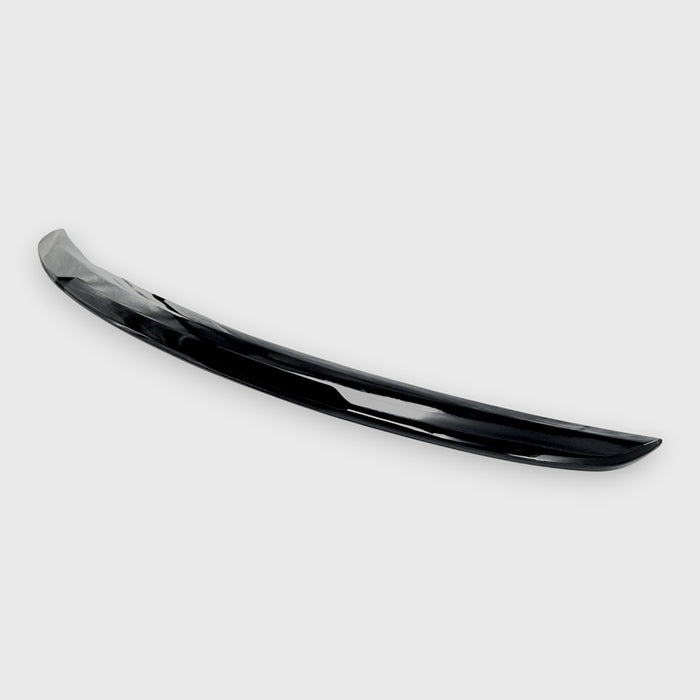 Black 2025 Toyota Camry spoiler on a white background