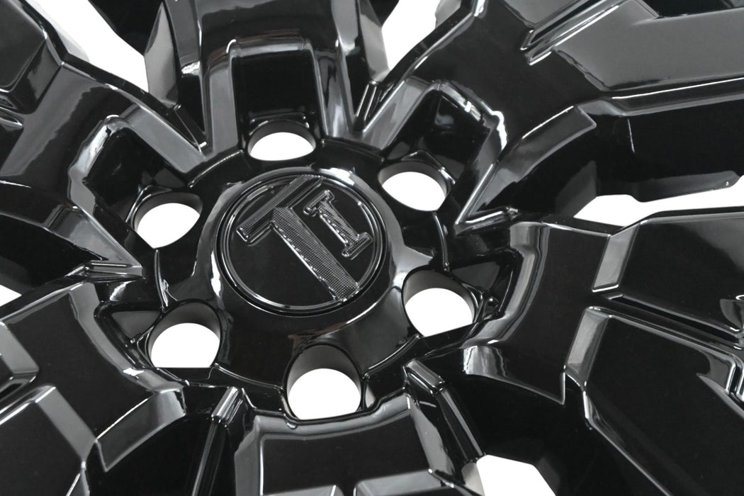Close-up of WSK750-17BLK gloss black wheel skins for 2023 Nissan Frontier