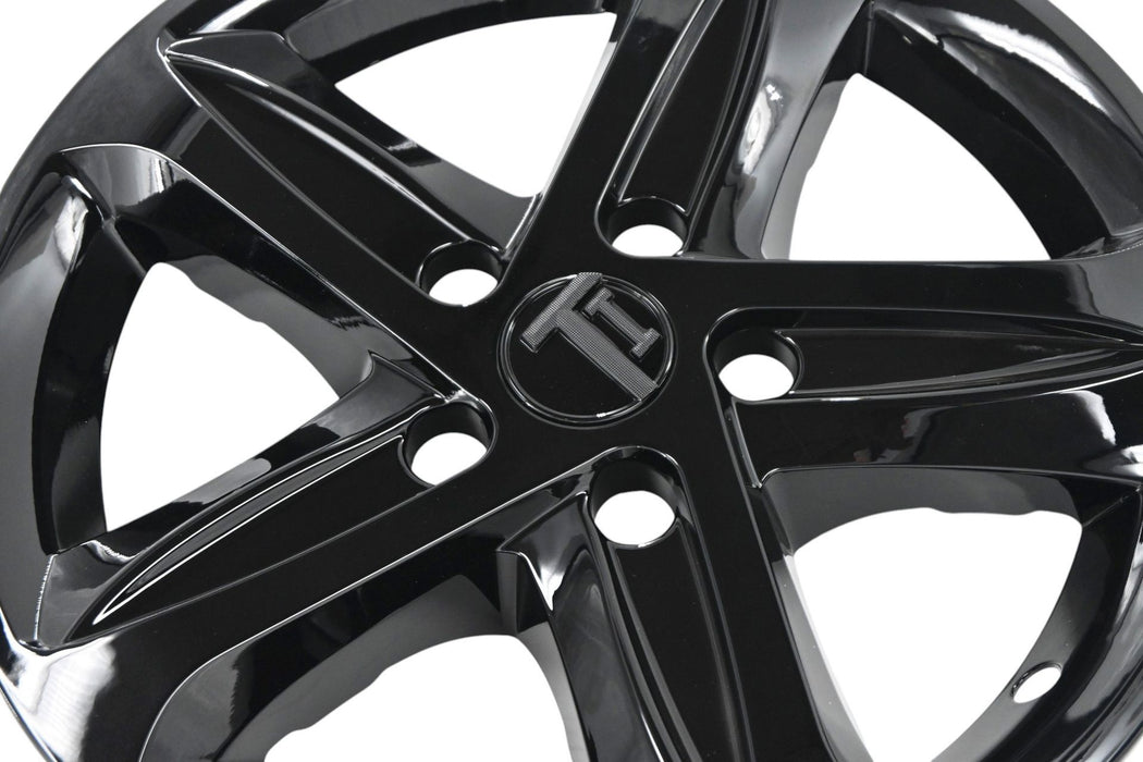 Close-up of WSK758-16BLK gloss black wheel skins for 2022 Chevrolet Malibu
